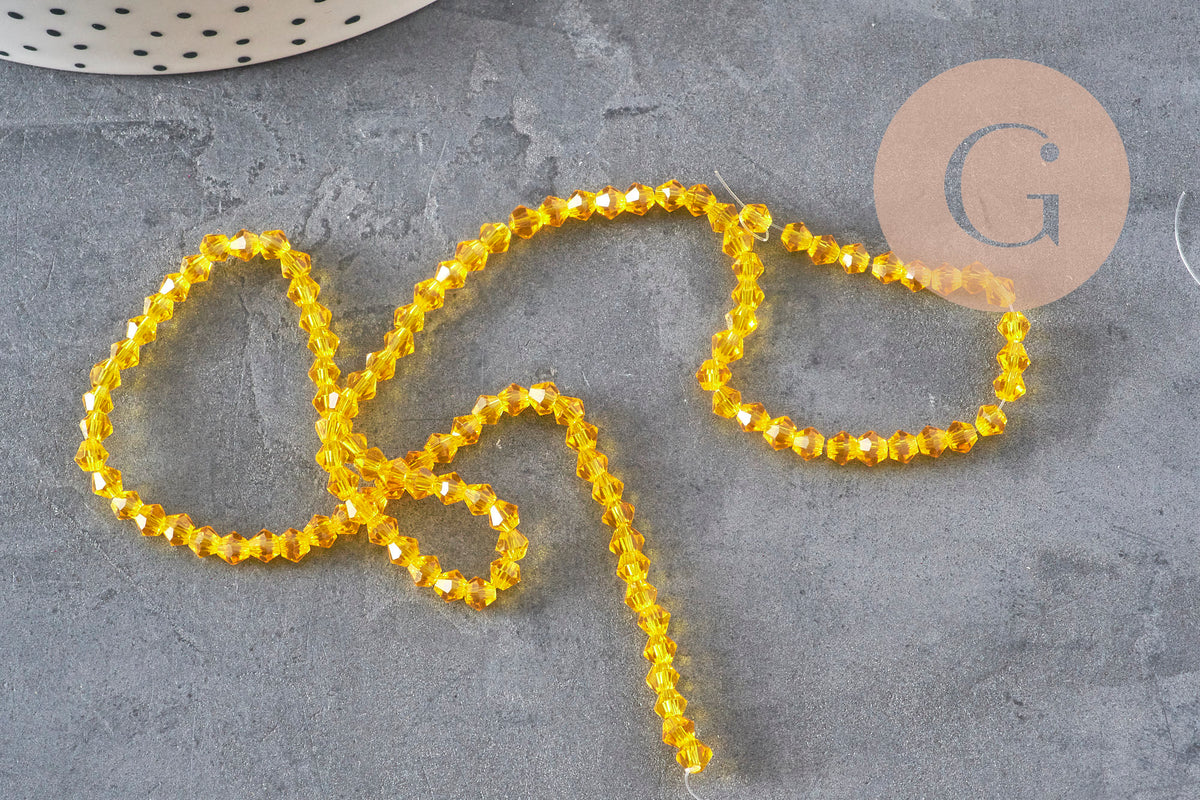 Perles toupies cristal à facette jaune 3.8x3mm, x1 fil de 32.5cm (G11343)