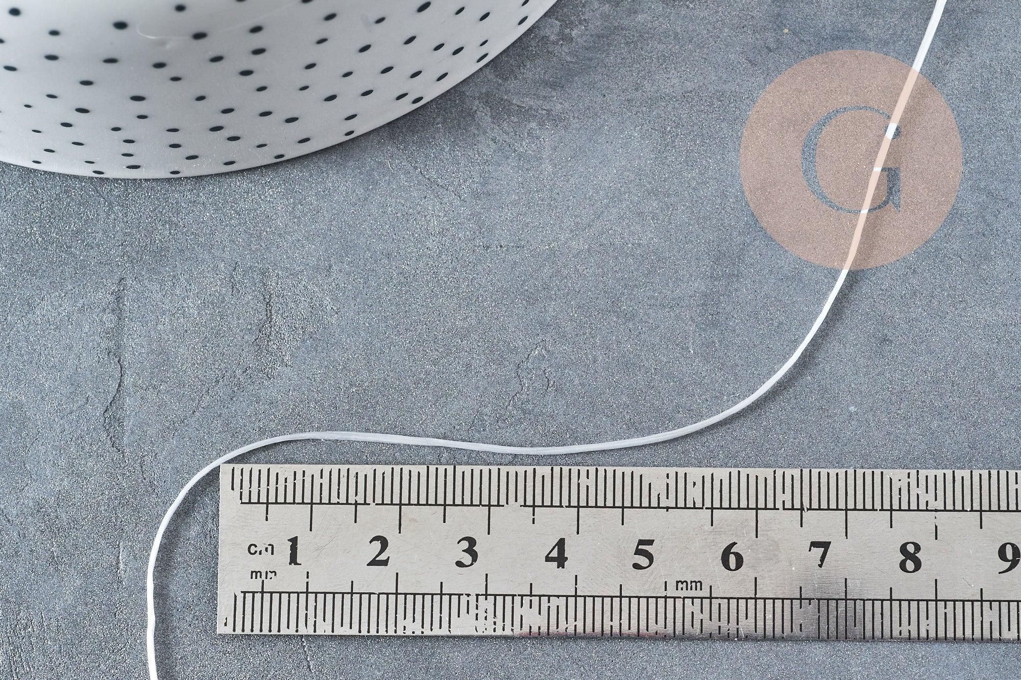Bobine de 10 mètres de fil élastique nylon blanc 0.8mm, x1 (G8914)