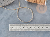 Cordon doré clair tressé polyester 0.8mm, x1 mètre (G5706)