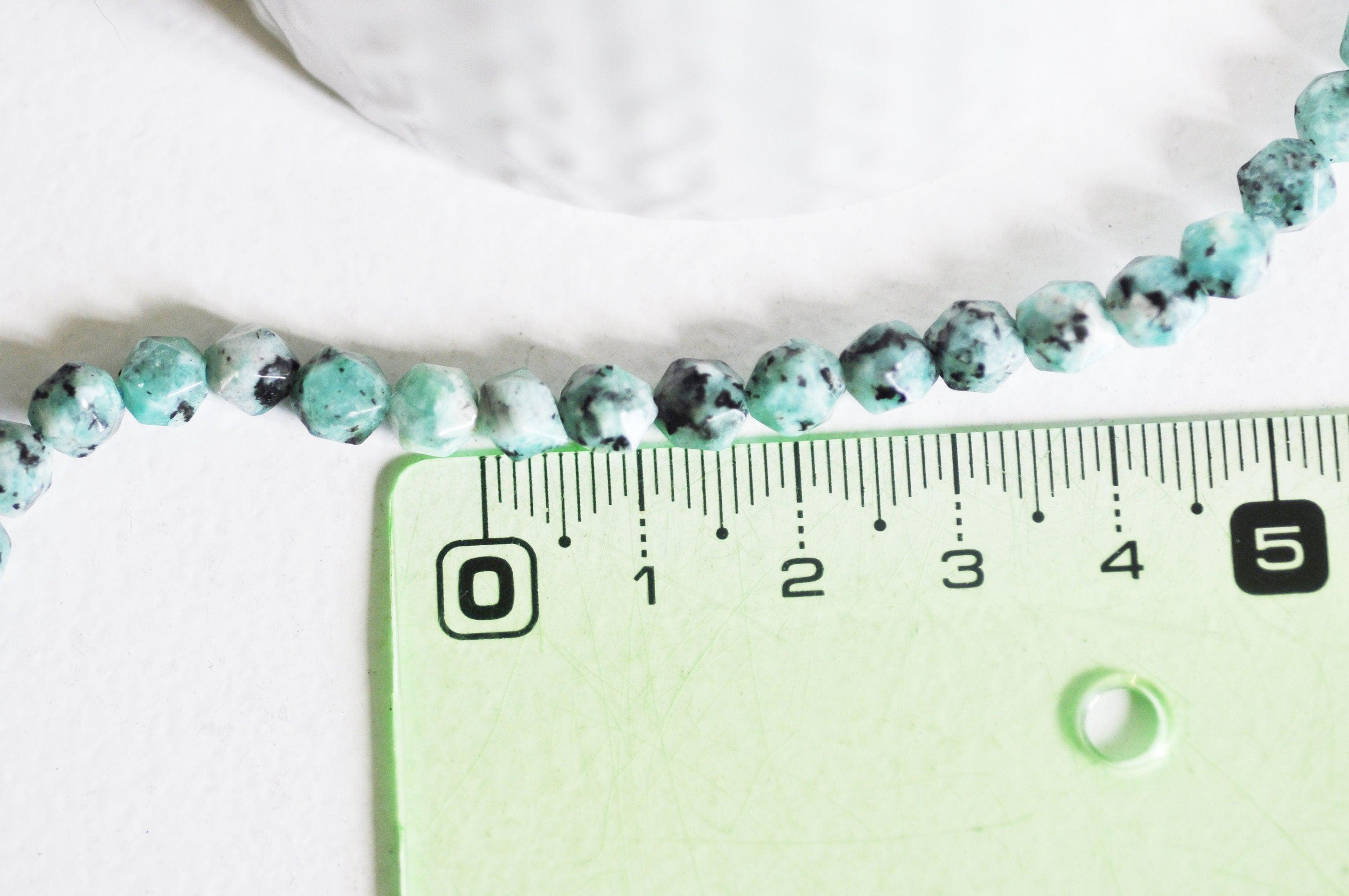 EP -Perles jaspe sésame facettes 6mm, x1 fil G2496