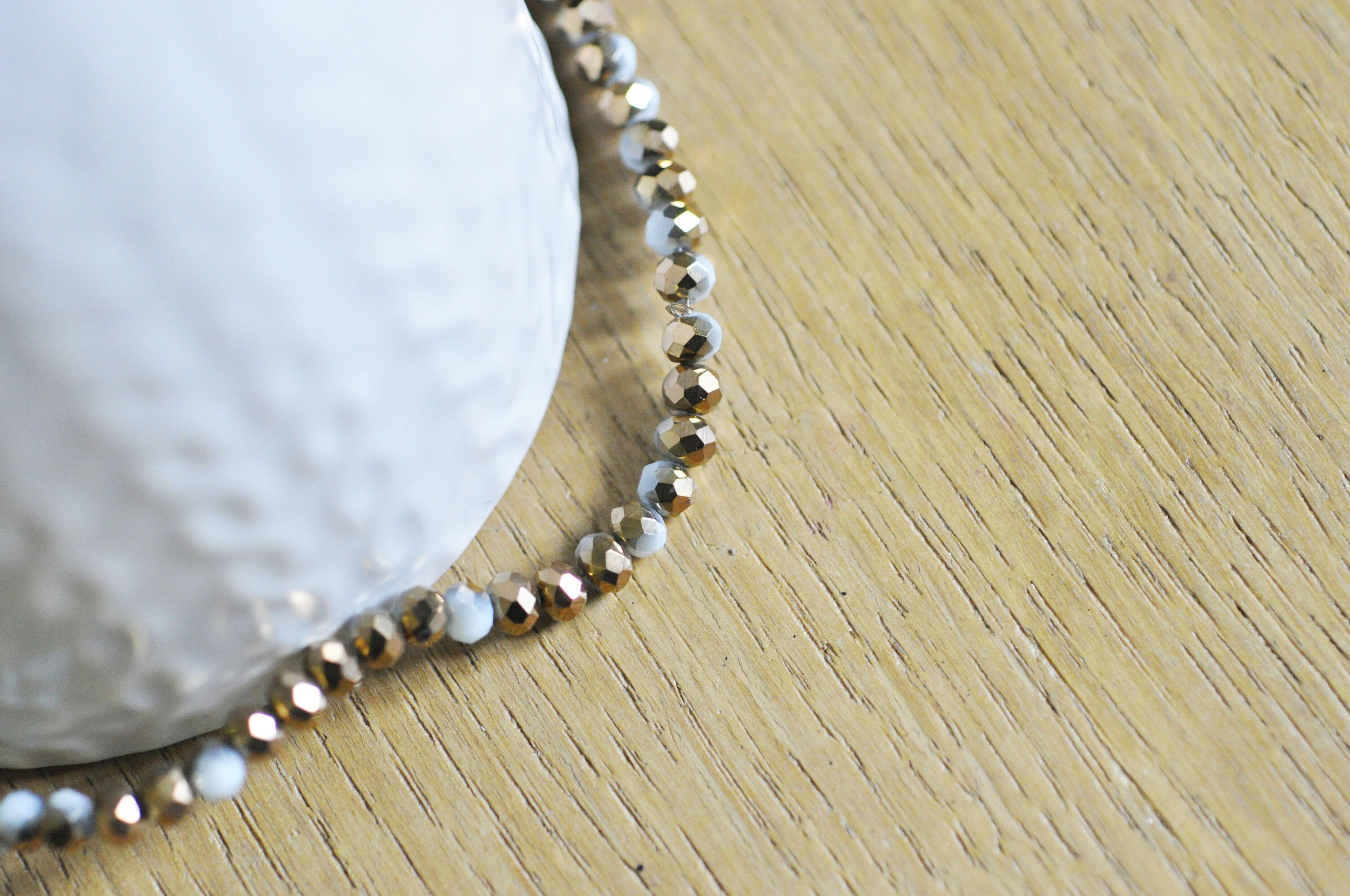 EP Perles toupies cristal blanc doré 4x3mm, x1 fil de 120