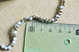 EP Perles toupies cristal blanc doré 4x3mm, x1 fil de 120
