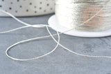 Fil nylon métallisé argent 0.6mm, fabrication bijoux,création broderie, x 5mètres G8490