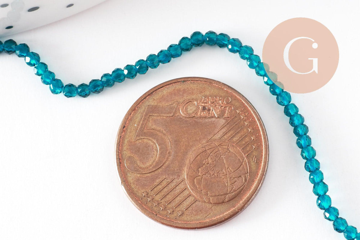 Perle ronde verre facettée transparente bleu turquoise 2mm, x1 fil de 37 cm (G7447)