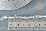 Clear quartz beads, 4–7mm, laid next to a ruler for scale, with a polka-dotted dish edge visible; 40cm strand for jewelry making.