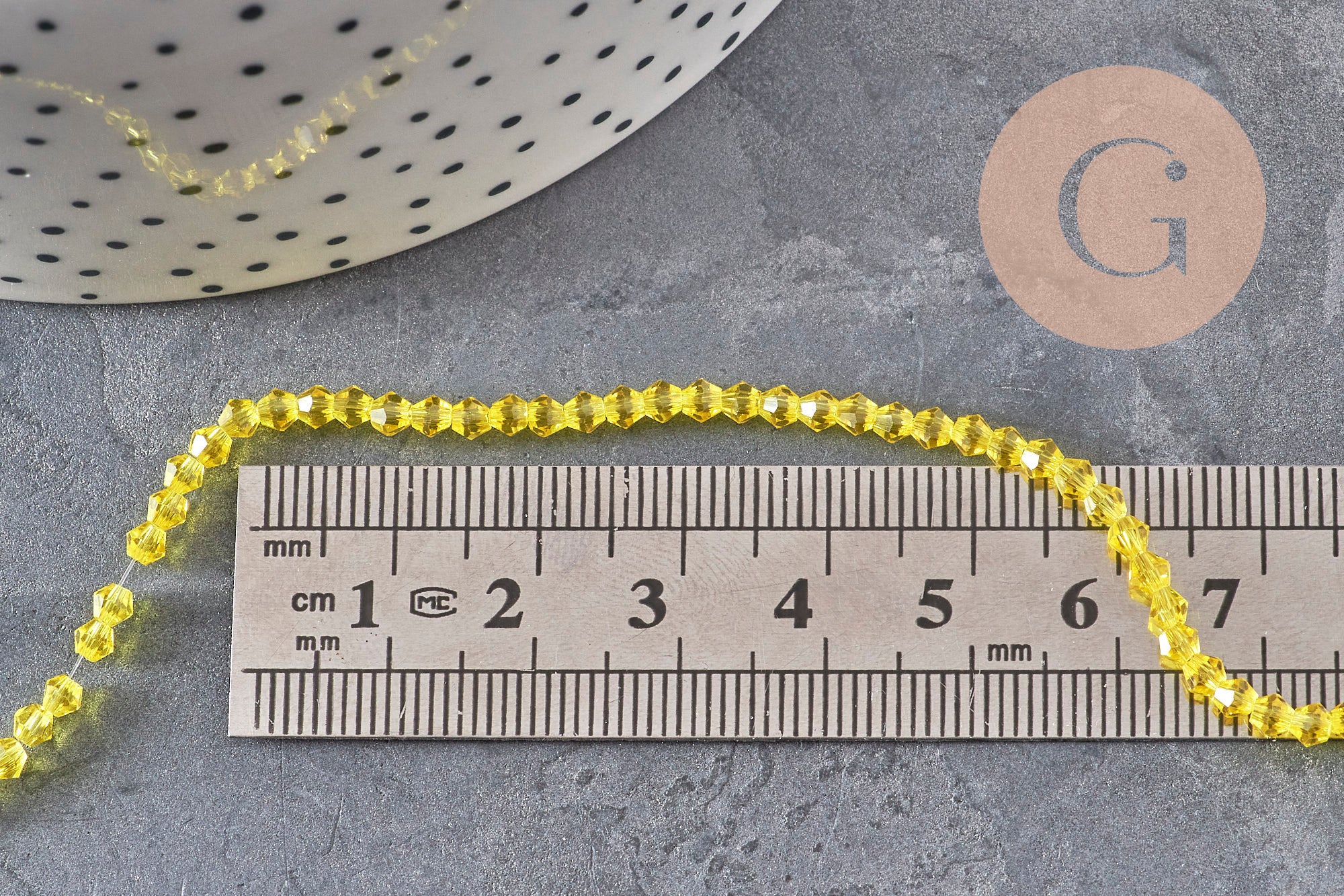 Perles cristal toupies à facette jaune transparent 3-3.3mm, x1 fil de 38cm (G11110)