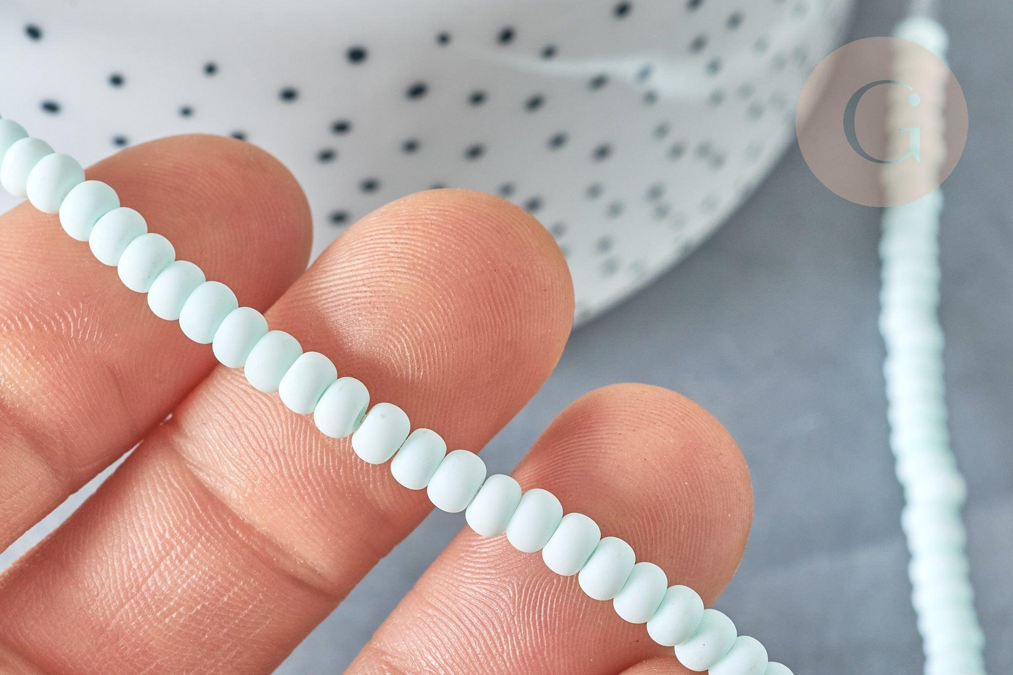 Perles porcelaine abacus vert pâle 4x3mm, fil de 38cm, x1 (G7810)