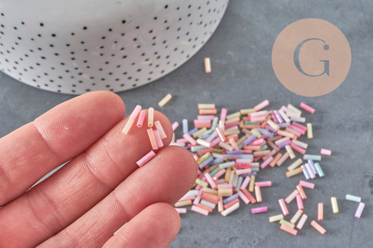Perles rocaille Tube pastel multicolore 6x2mm, x 10gr (G1651)