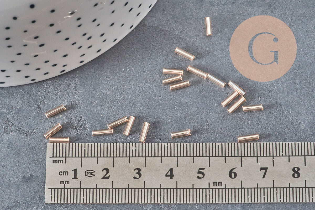 Perles rocaille Tube rose champagne metallisé 6-8mm x 1.6mm, x10gr (G2459)