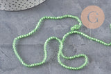 Perles cristal toupies à facette vert transparent 3-3.3mm, x1 fil de 38cm (G11111)