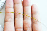 EP Fil nylon 2m métallique acier doré 0,6mm G3791