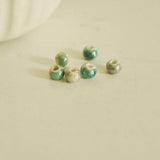EP -perle porcelaine vert irisé 7mm, x5 (G2106)
