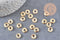 Perles intercalaires rondelles acier 304 inoxydable doré 8mm, x20 (G3464)
